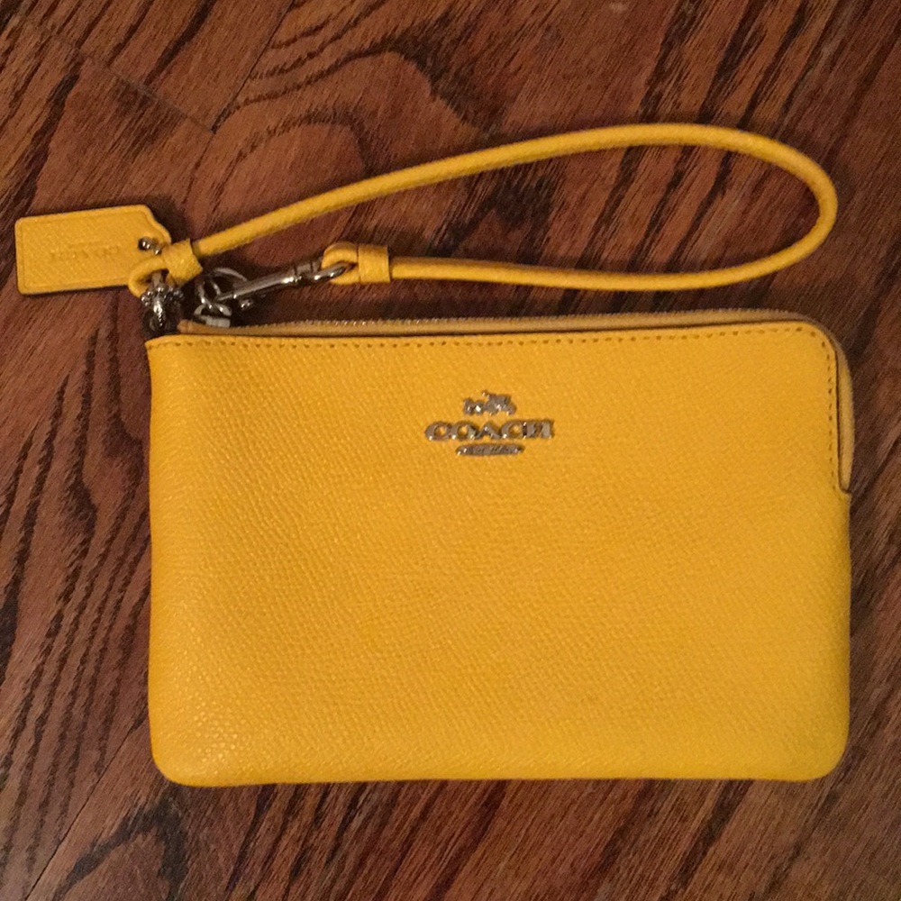 Yellow COACH wristlet